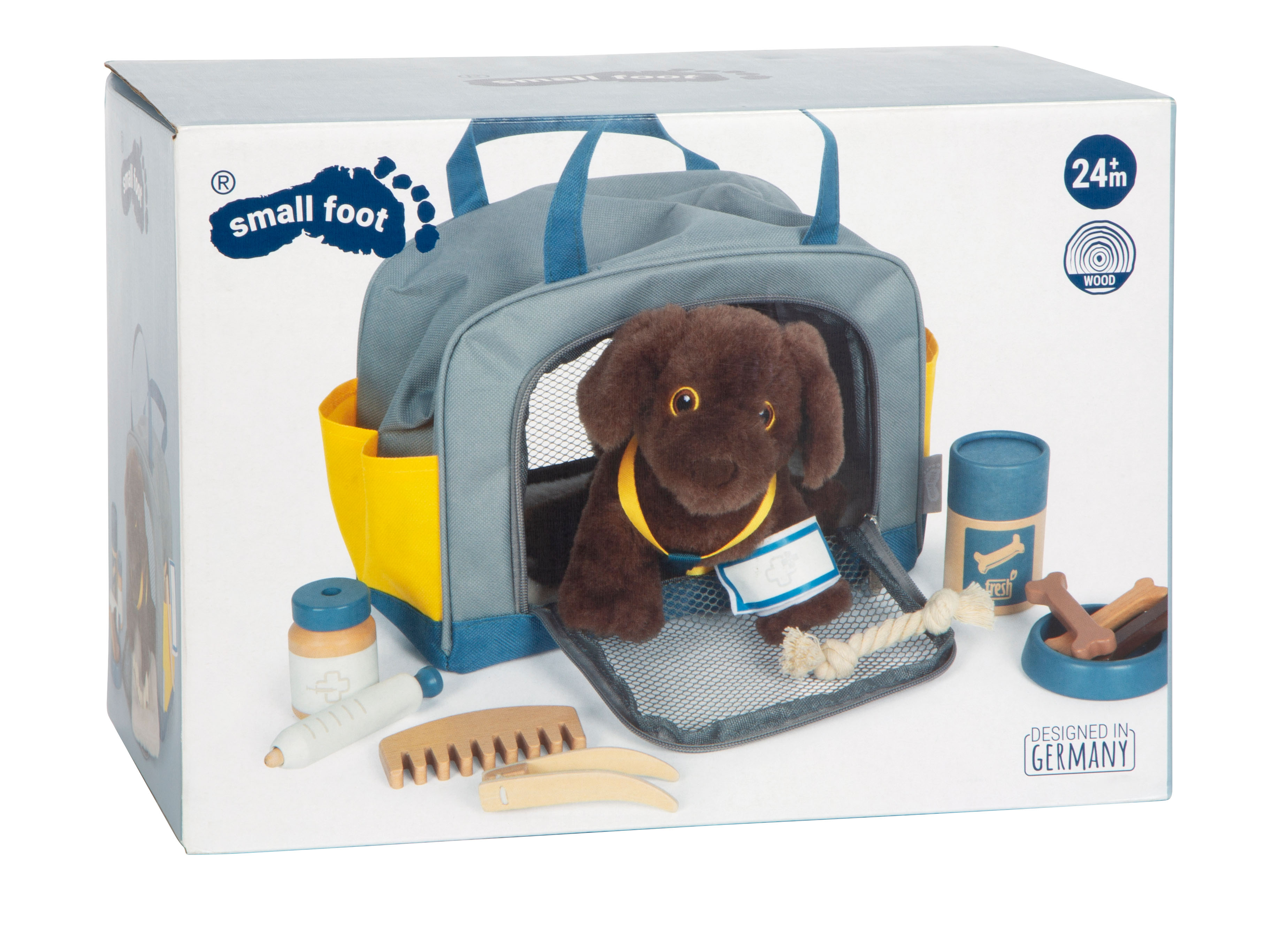 Hund mit Tasche und Pflegeset in der Verpackung