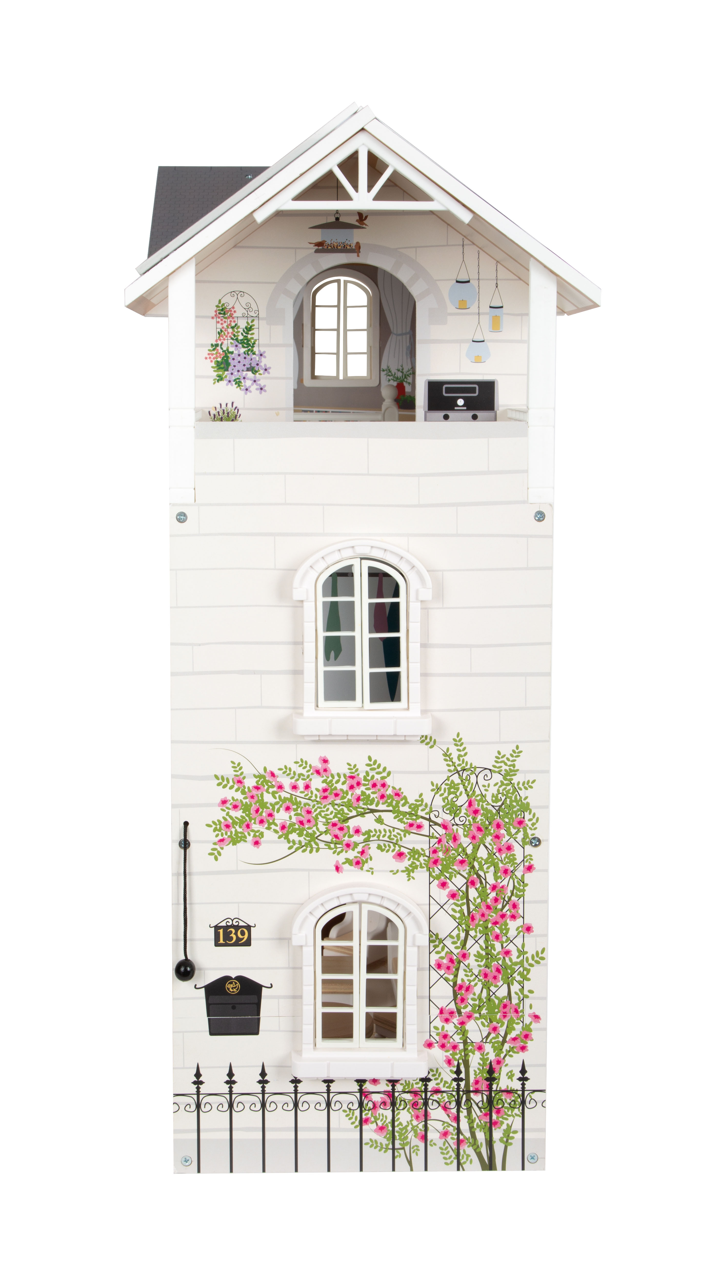 Kind spielt mit Puppenhaus aus Holz und Spielfiguren