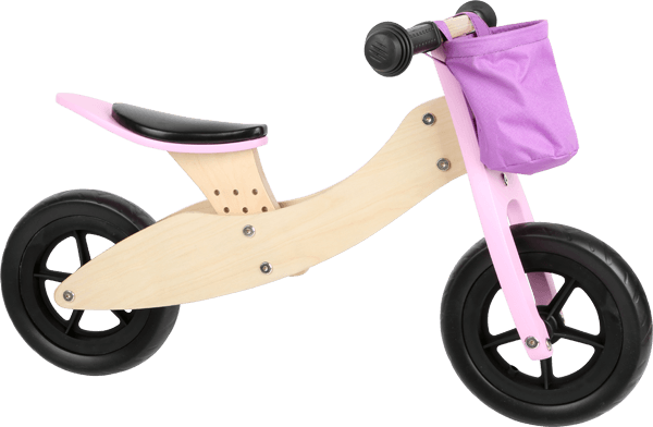 Laufrad aus Holz mit rosafarbener Lenkertasche