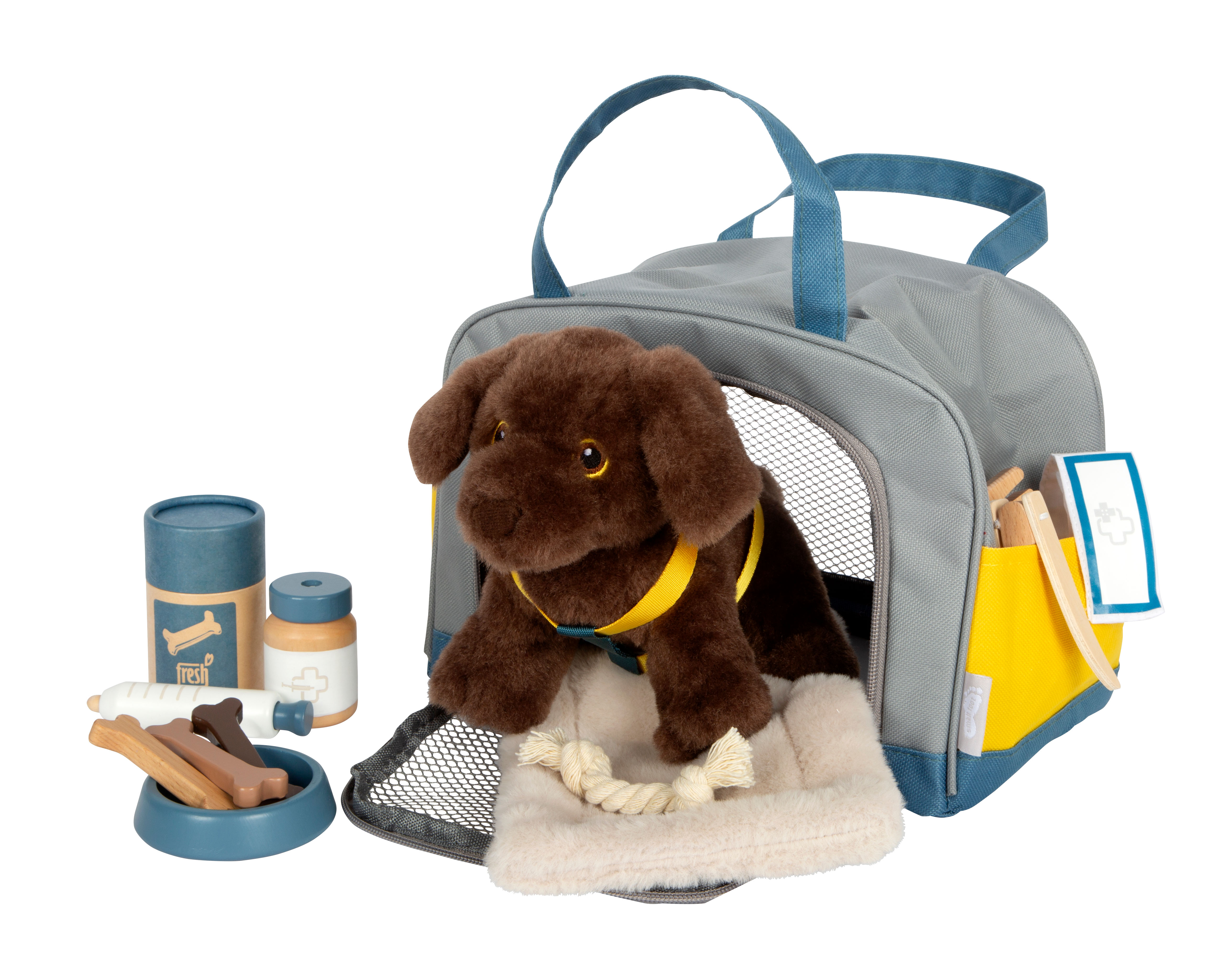 Hund mit Tasche und Pflegeset mit vollständig verstautem Zubehör